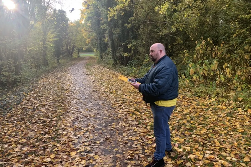 Mark Tomes looking at plans for housing development on Moons Moat Drive