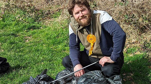 Candidate Andrew Fieldsend-Roxborough collecting litter 